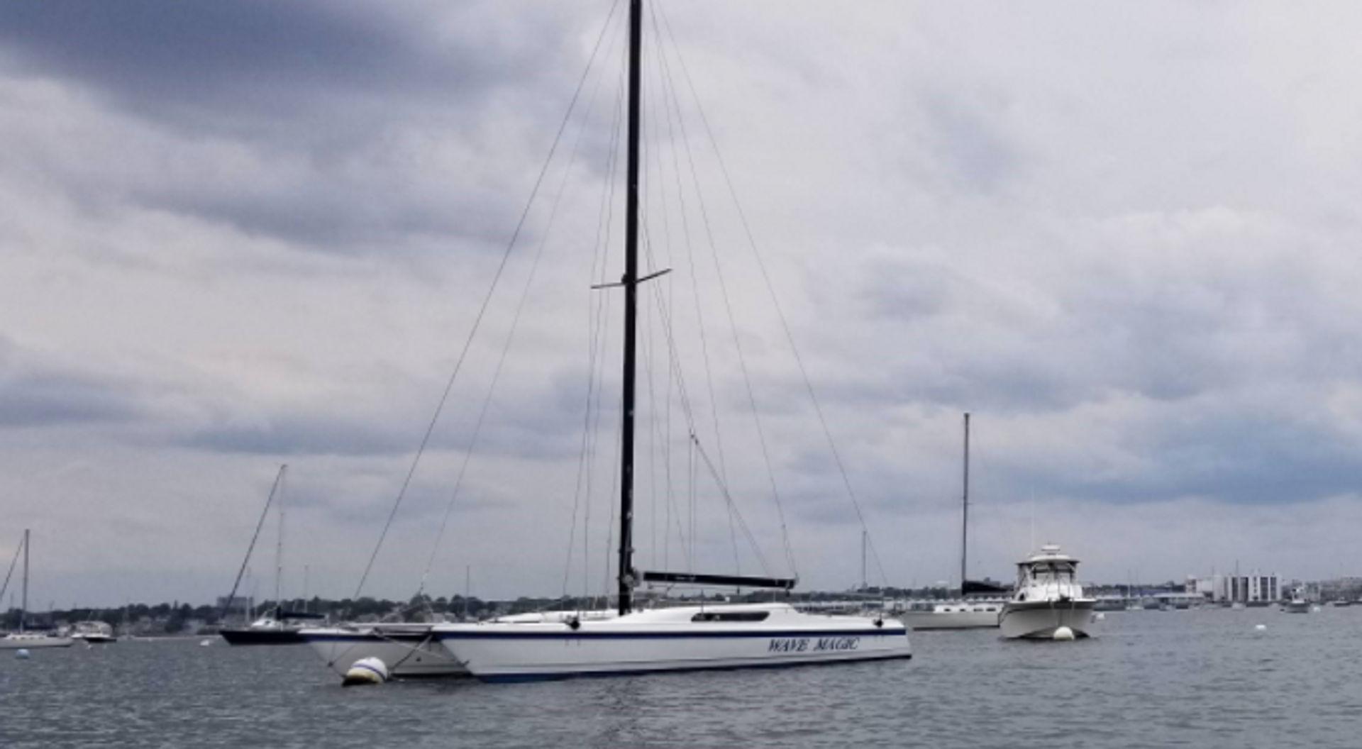 At mooring in Salem Harbor without sails.