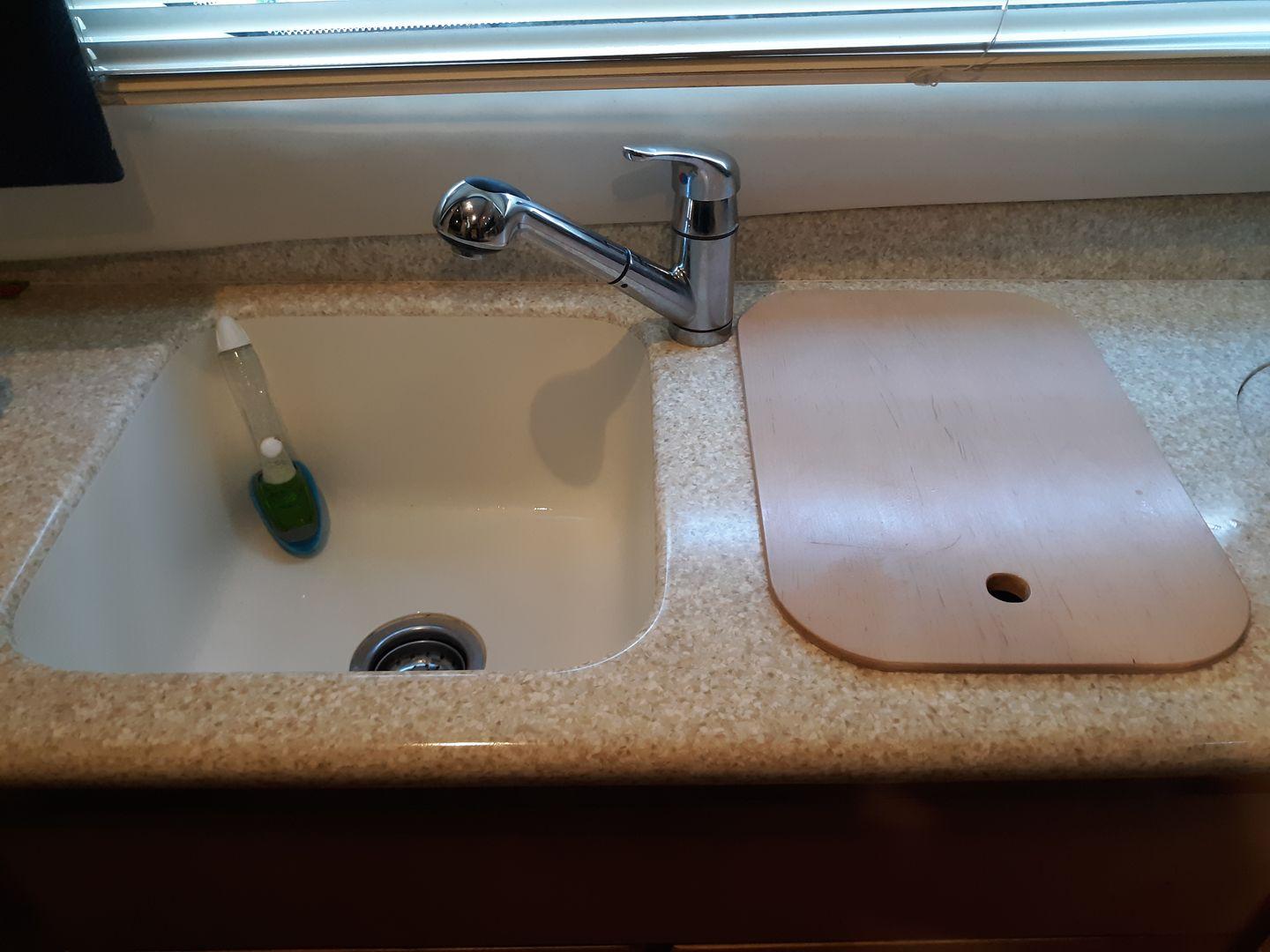 Double sink with custom cover. 