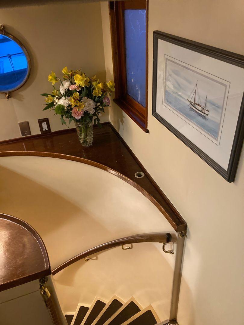 Stairs to owners stateroom, private bath and aft door to engine room.